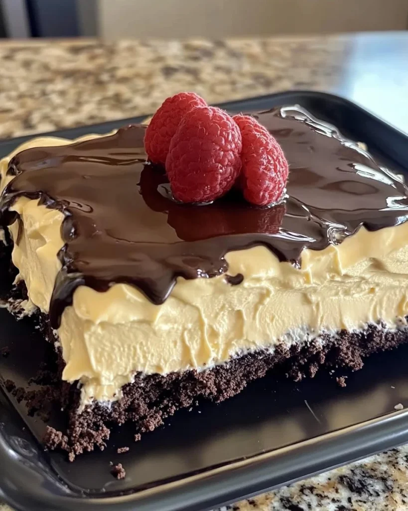 Delicious no-bake Eclair Cake layered with cream and chocolate