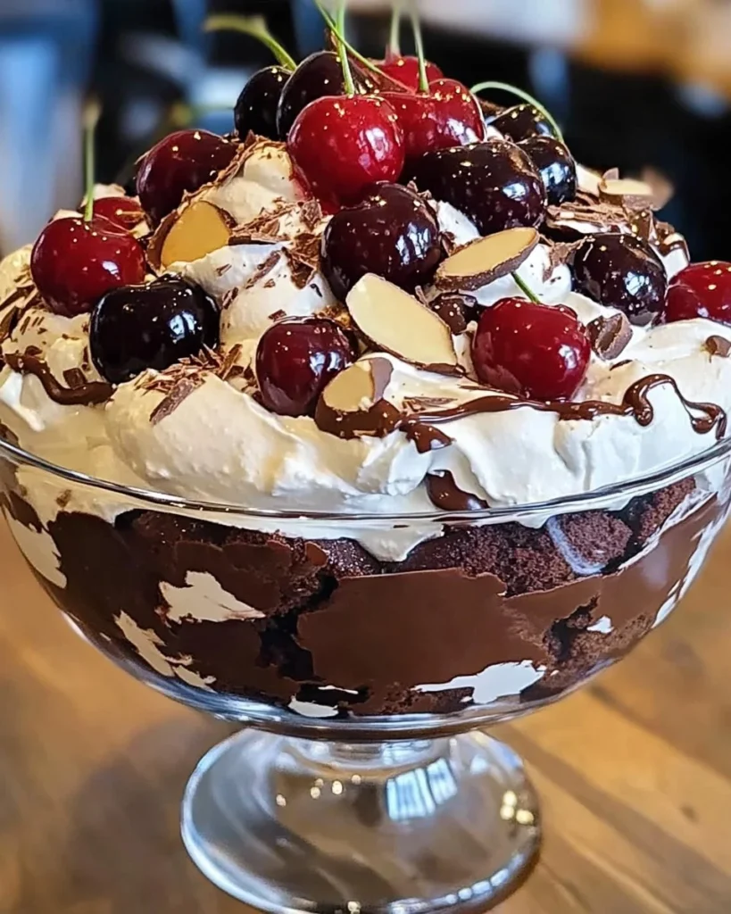 Delicious cherry chocolate trifle layered with creamy chocolate and fresh cherries.