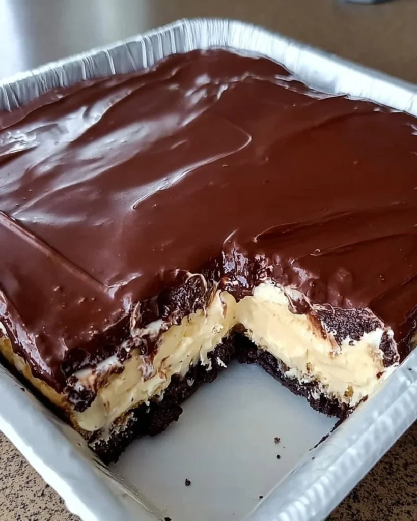 No-Bake Chocolate Eclair Cake topped with chocolate ganache